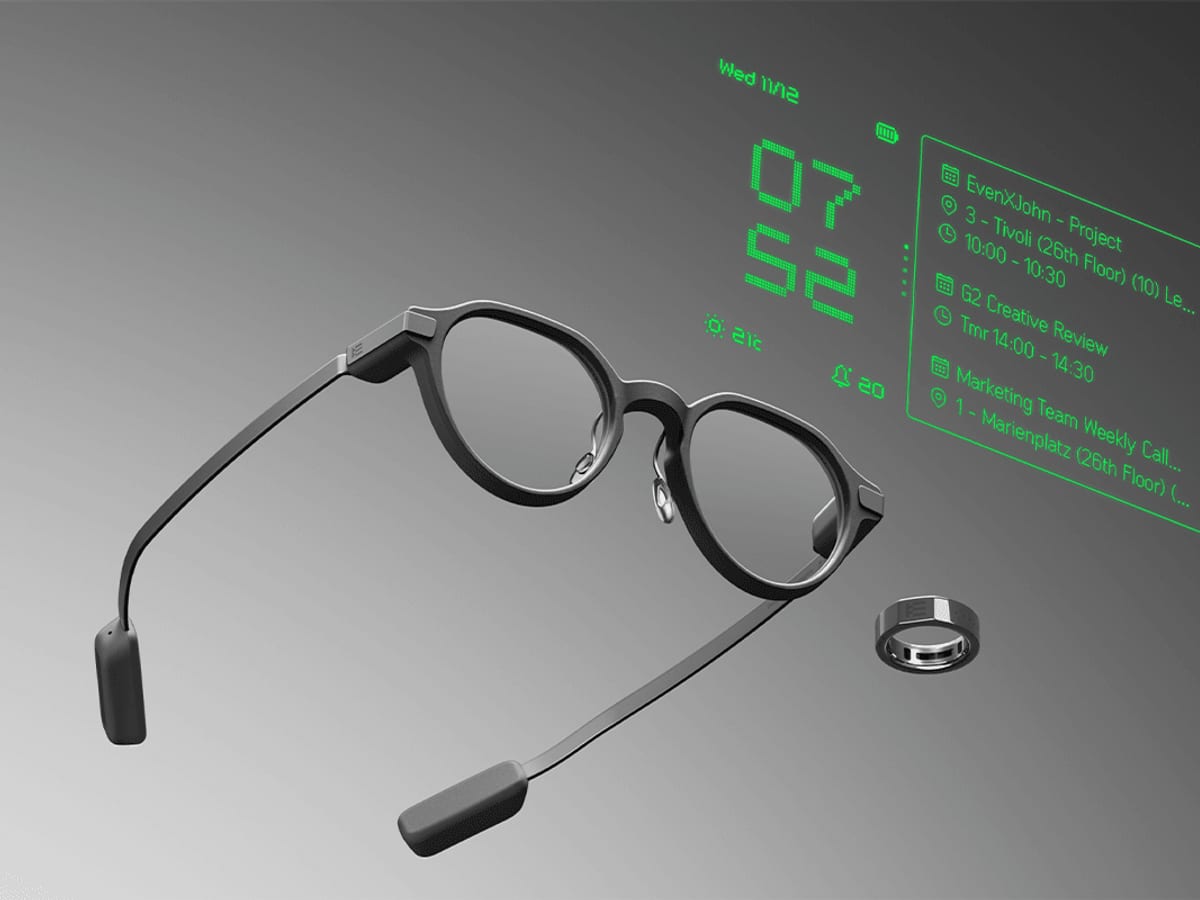 Minimal smart glasses and a smart ring shown with a green augmented interface.